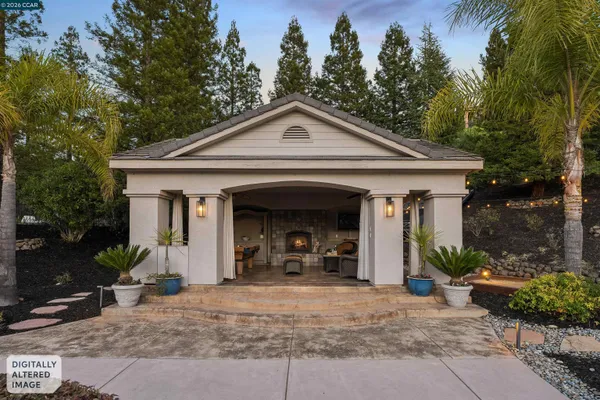 a front view of a house with garden