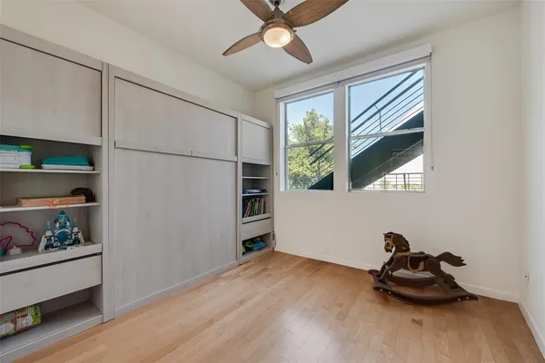 a room with window and cabinet