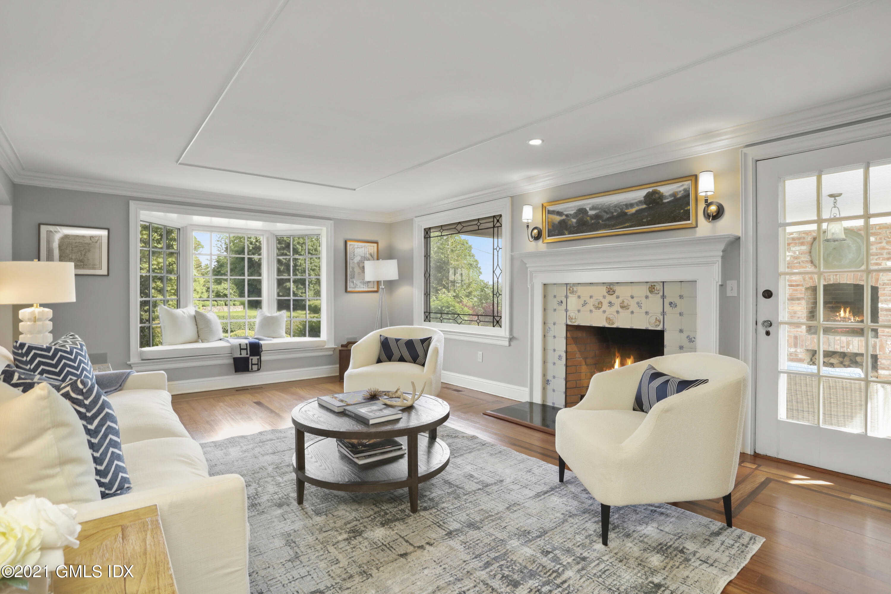 74 Cedar Cliff Road Riverside, CT 06878 - Photo 4 of 66 a living room with furniture and a fireplace