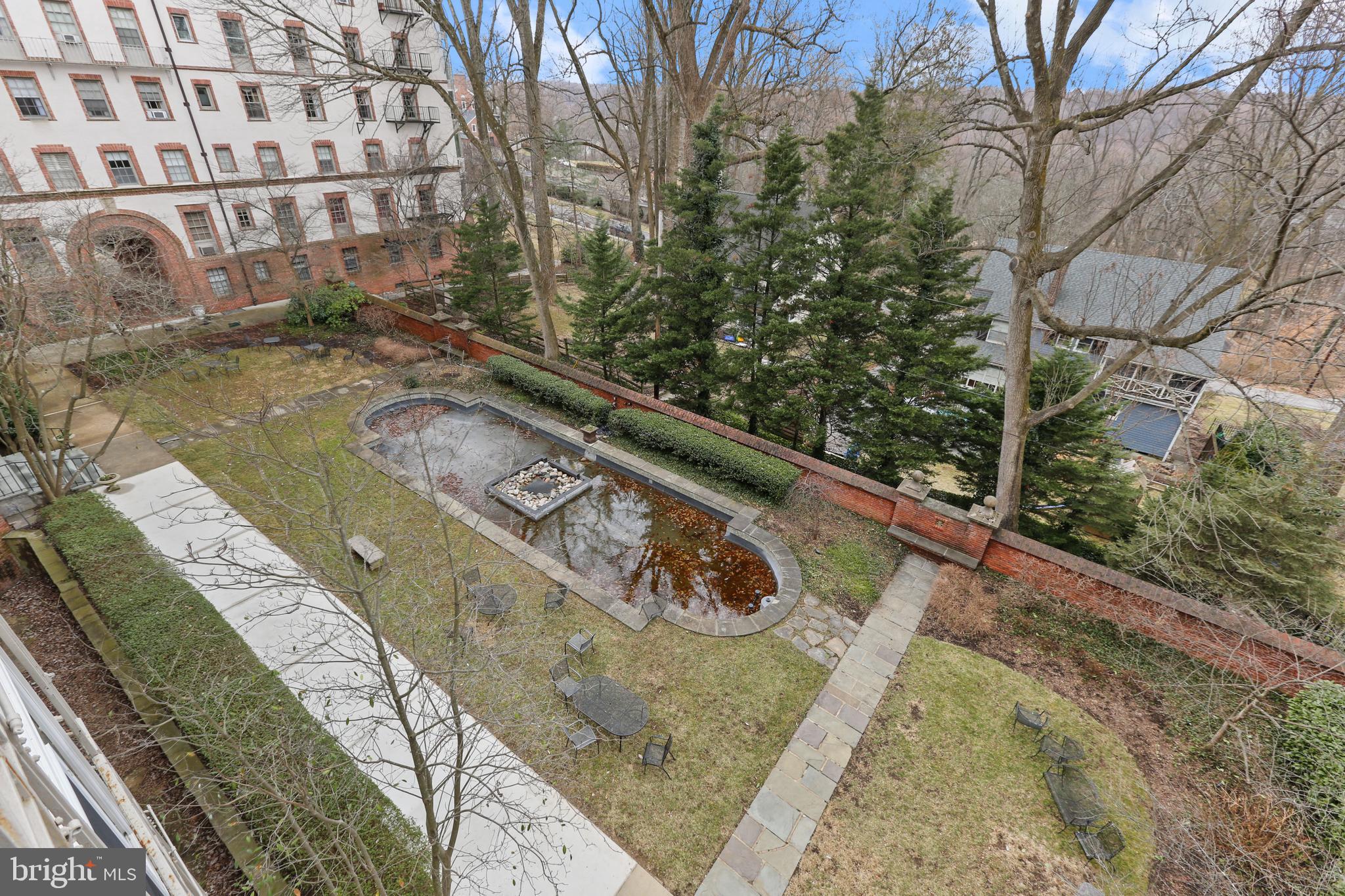 6 Upland Road, Unit K4 Baltimore, MD 21210 - Photo 33 of 37 view from sunroom of shared courtyard garden