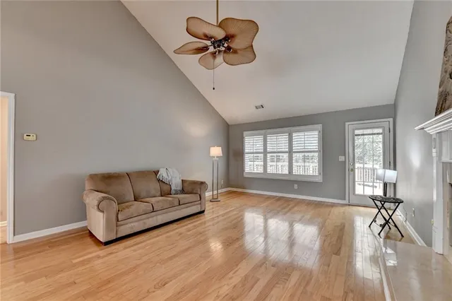 a kitchen with stainless steel appliances granite countertop a sink a stove a microwave and cabinets