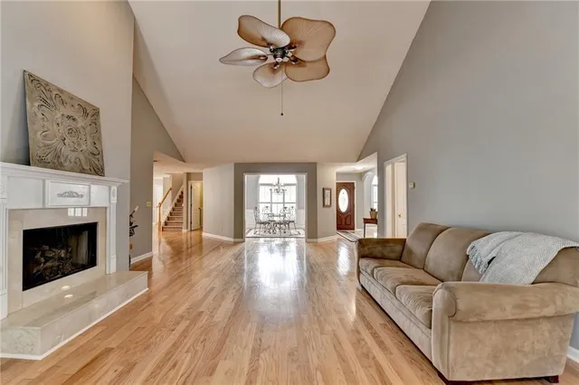 a kitchen with granite countertop white cabinets sink and window