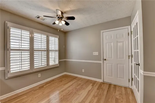 a bathroom with a tub sink a mirror and a shower