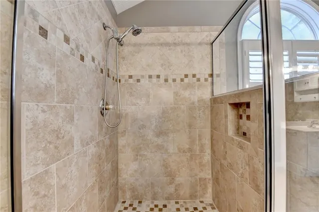 a bathroom with a sink a toilet and shower curtain