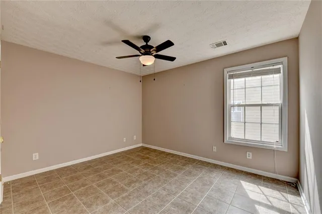 a view of a livingroom with an empty space and a fireplace