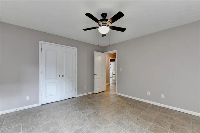 a kitchen with stainless steel appliances granite countertop a stove refrigerator sink and microwave