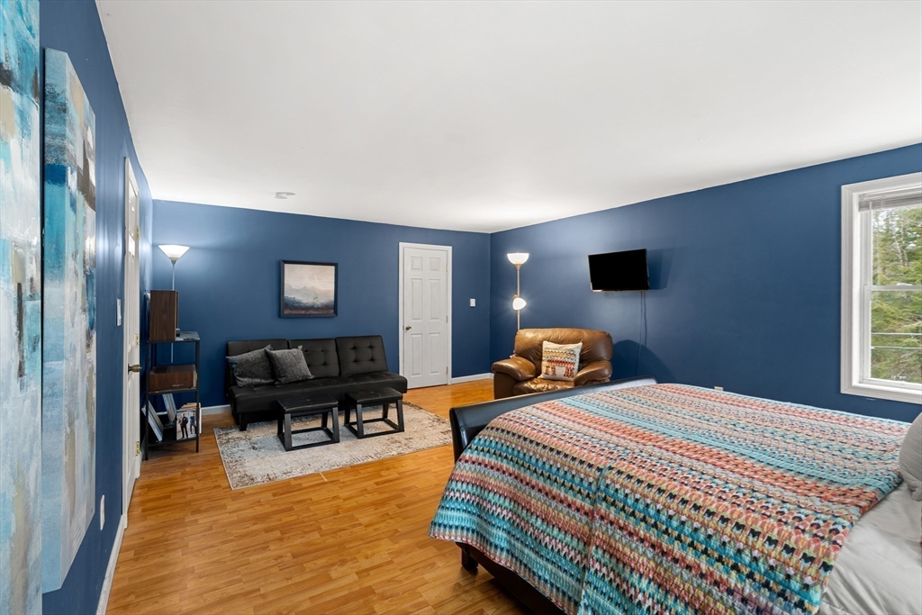 101 Rogers Road Center Barnstead, NH 03225 - Photo 14 of 32 a bedroom with furniture and a flat screen tv