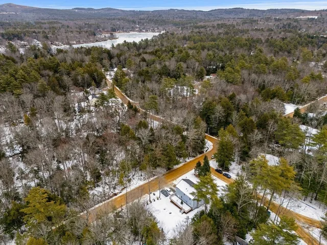 an aerial view of mountain with residential trees