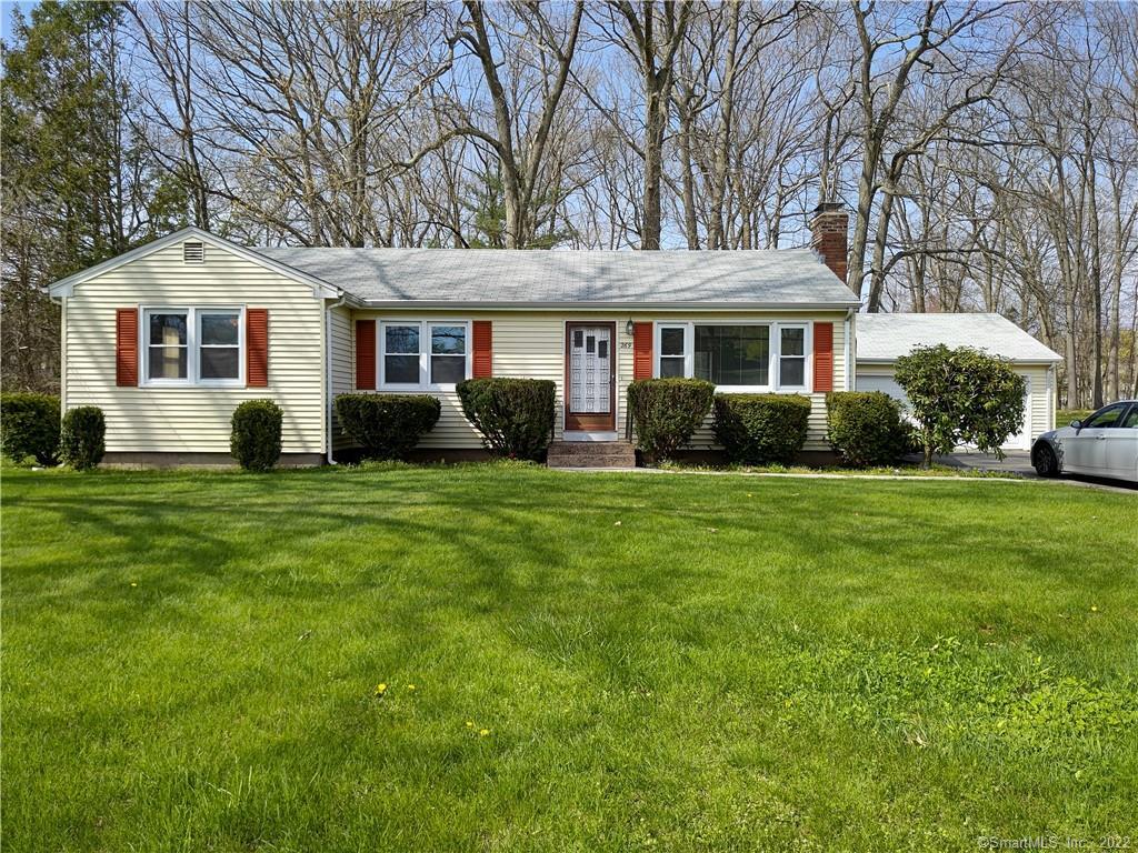269 Great Swamp Road Glastonbury, CT 06033 - Photo 1 of 1 a front view of a house with a yard and trees