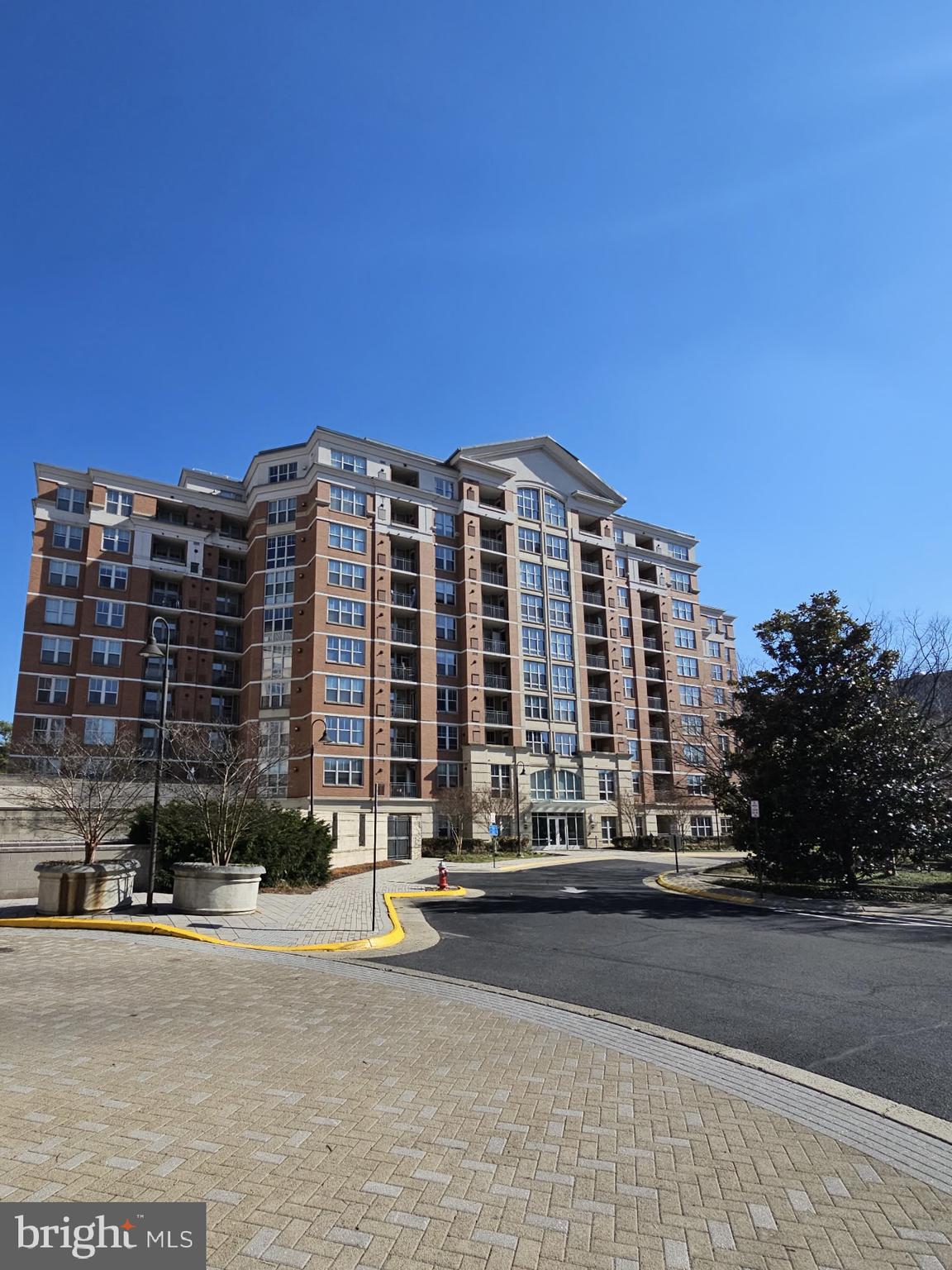 11760 Sunrise Valley Drive, Unit 912 Reston, VA 20191 - Photo 1 of 7 a front view of a building with a street