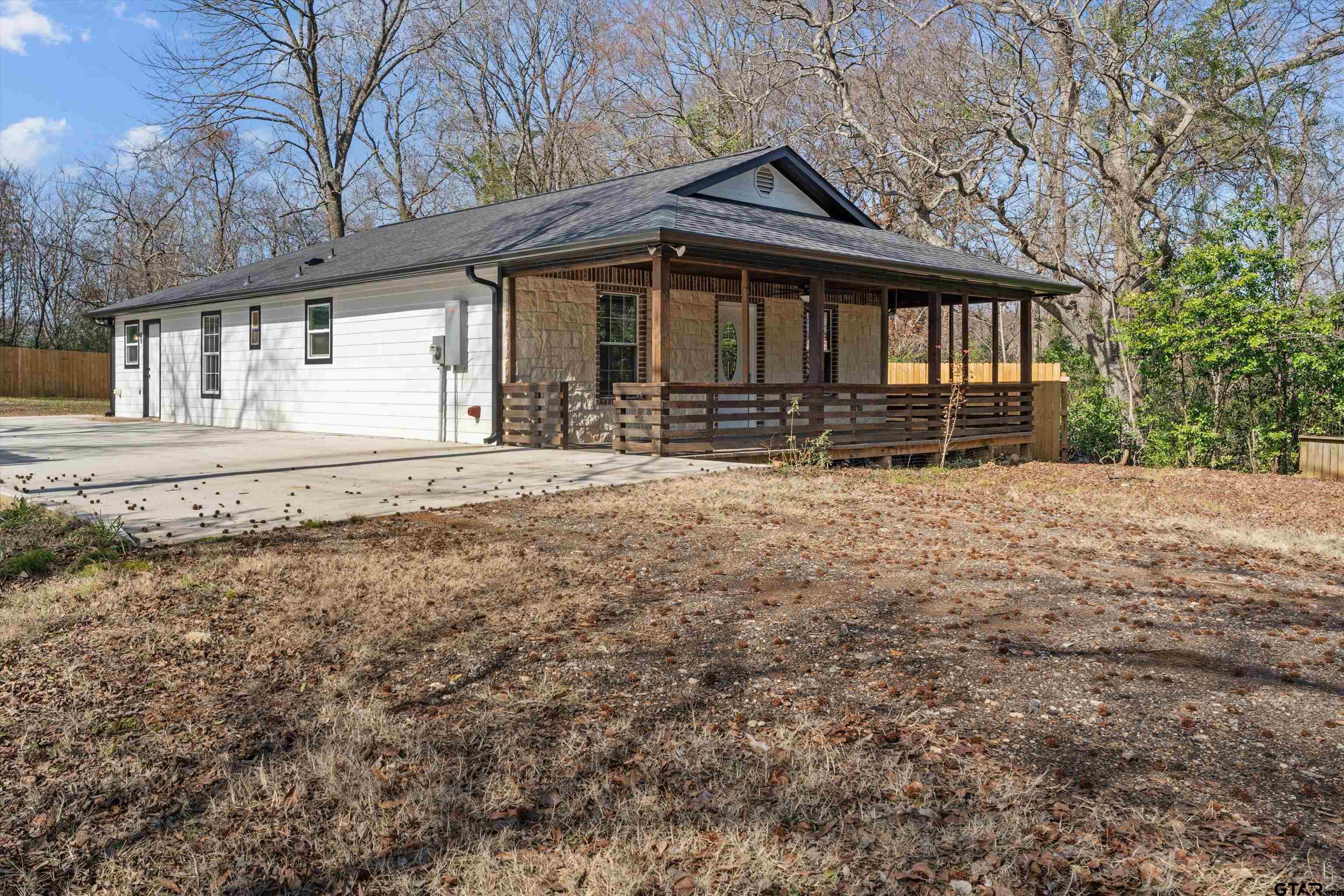 5881 Jefferson Avenue Tyler, TX 75708 - Photo 3 of 20 a front view of a house with a yard