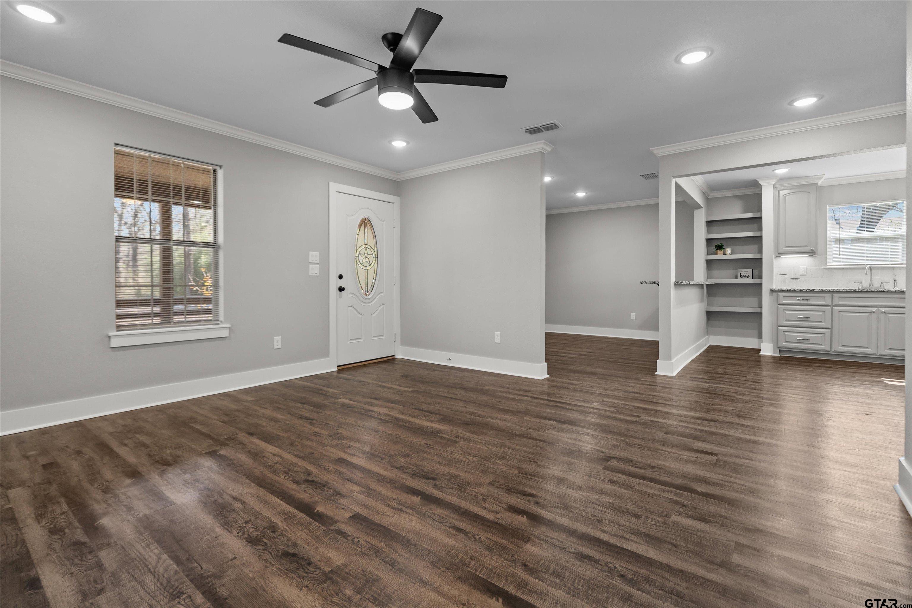5881 Jefferson Avenue Tyler, TX 75708 - Photo 4 of 20 a view of empty room with wooden floor and window