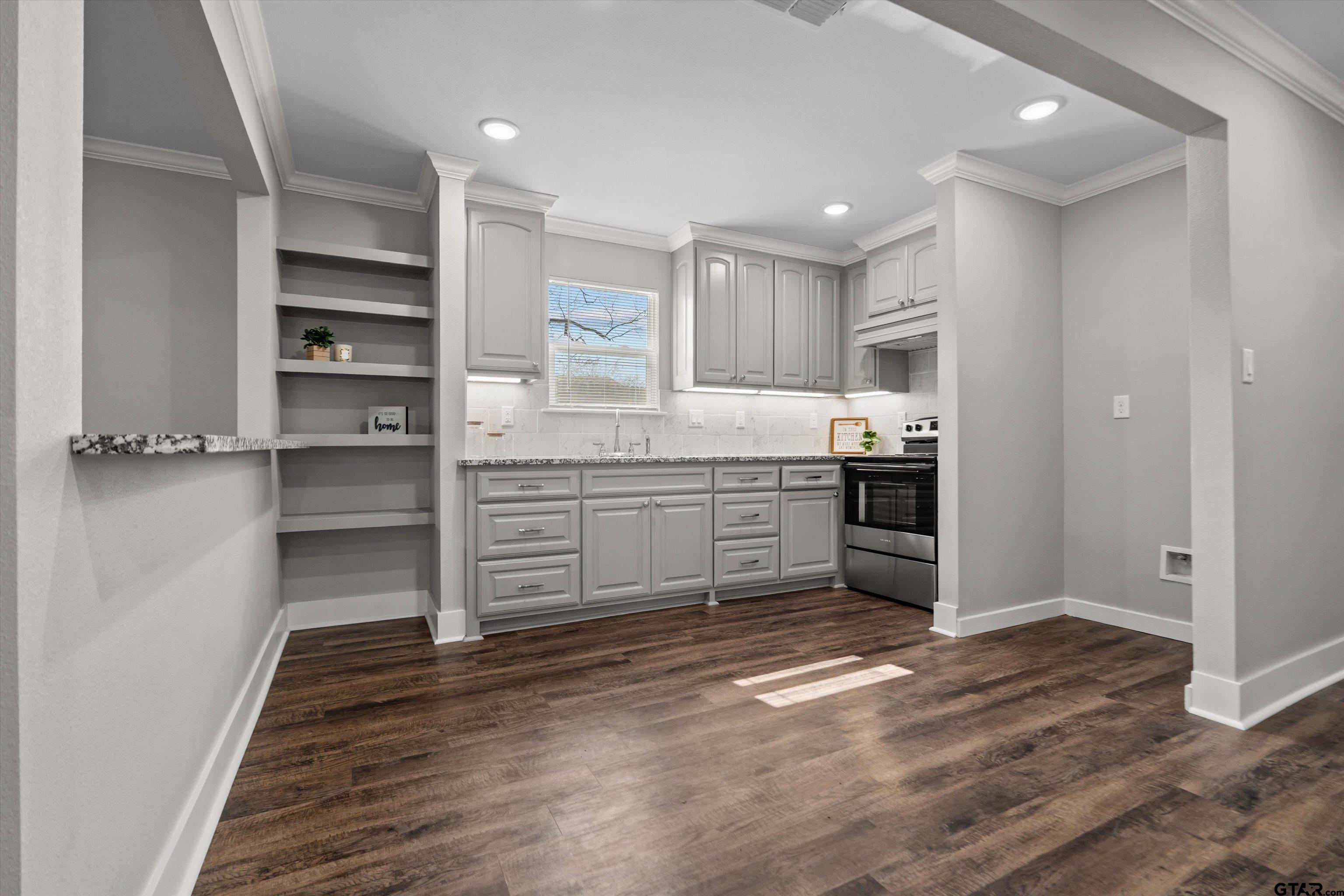 5881 Jefferson Avenue Tyler, TX 75708 - Photo 5 of 20 a view of kitchen with wooden floor