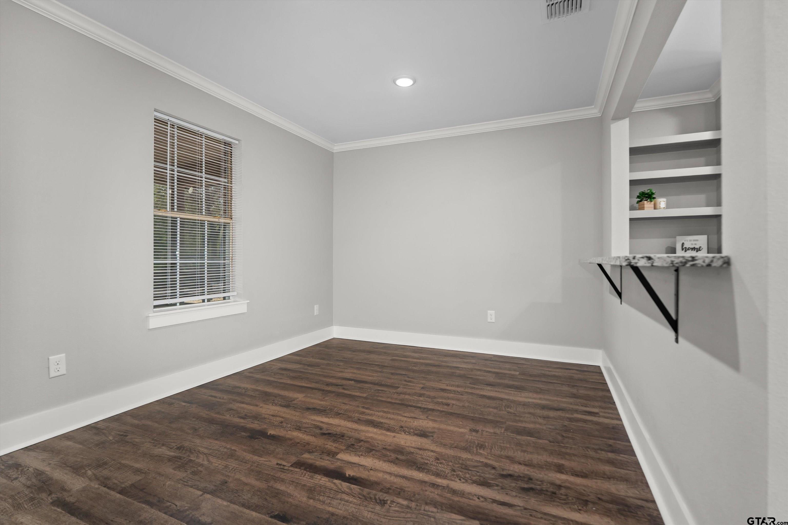 5881 Jefferson Avenue Tyler, TX 75708 - Photo 9 of 20 a view of a livingroom with wooden floor and stairs
