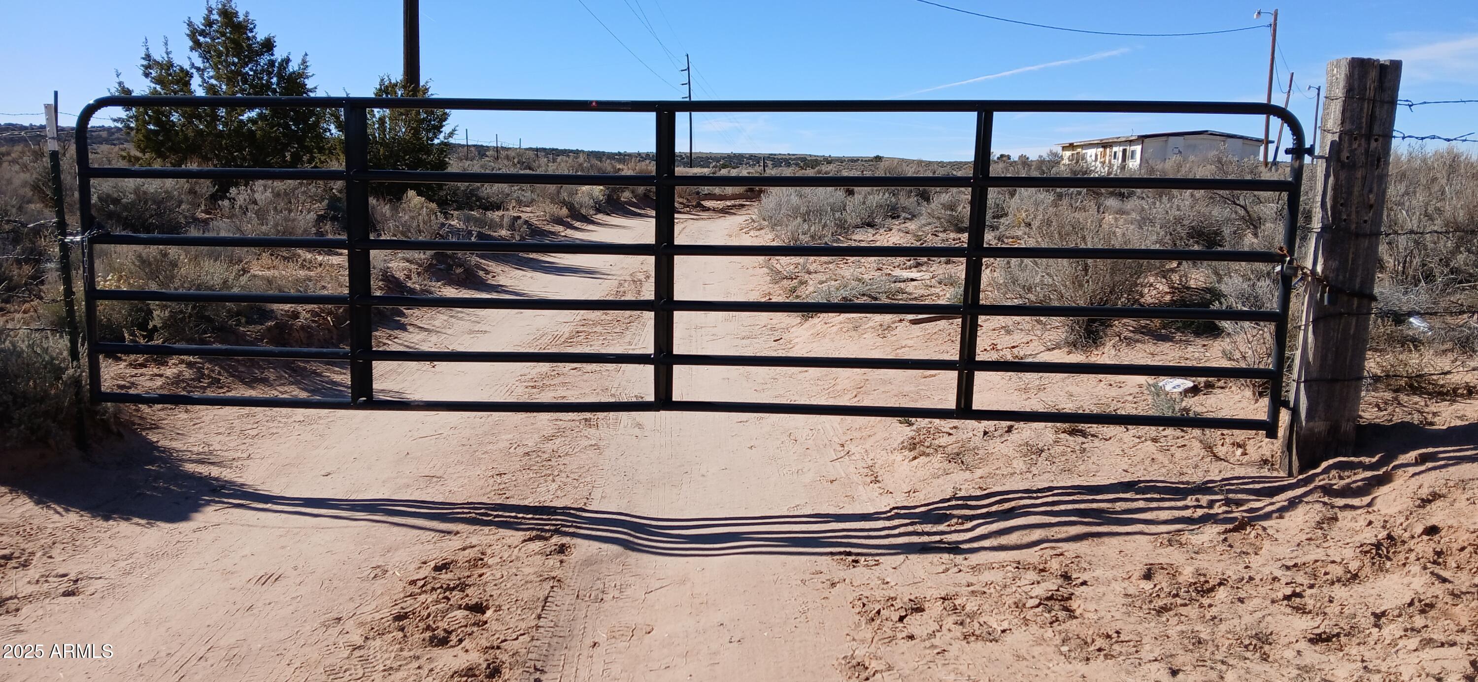 3.02-acres 3.02-acres Unnamed Road, Unit 457 Chambers, AZ 86502 - Photo 19 of 20 a view of a black gate