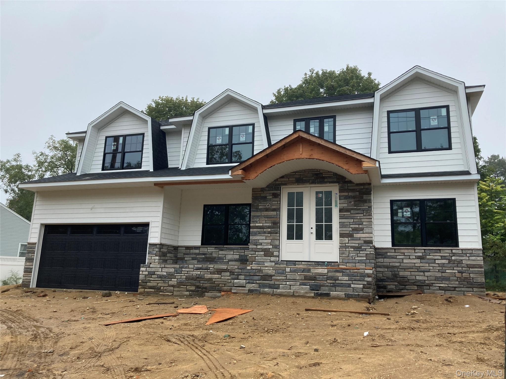 a front view of a house with yard