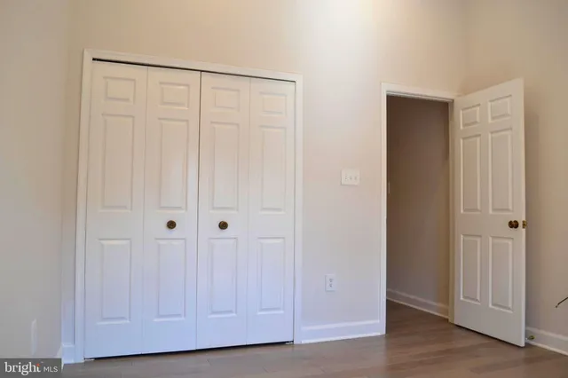 an empty room with wooden floor