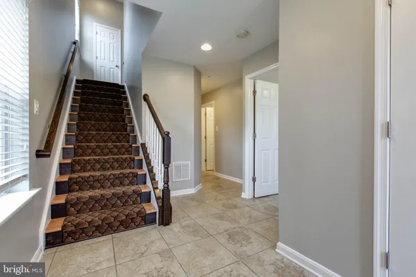 a view of entryway with stairs