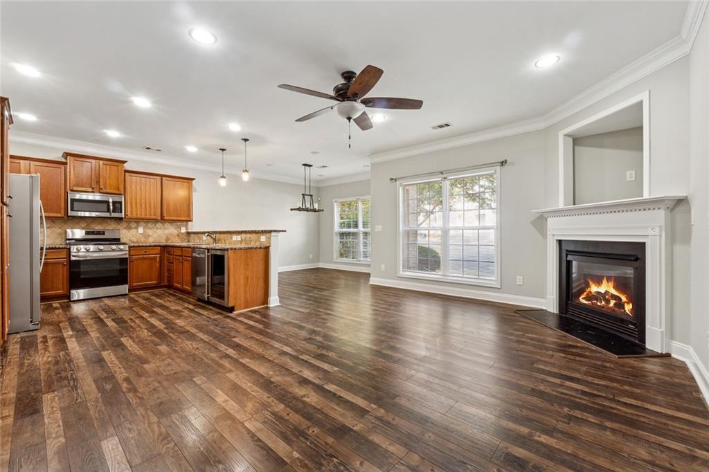 3184 Buck Way Alpharetta, GA 30004 - Photo 13 of 48 a view of a kitchen with a stove cabinets and wooden floor