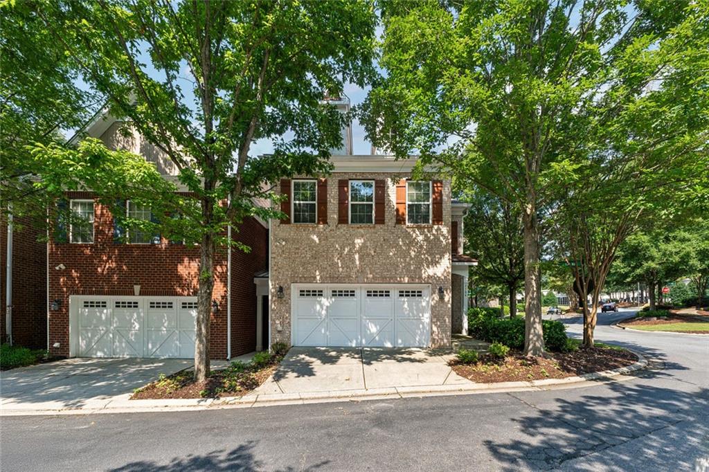 3184 Buck Way Alpharetta, GA 30004 - Photo 2 of 48 a front view of a house with a yard