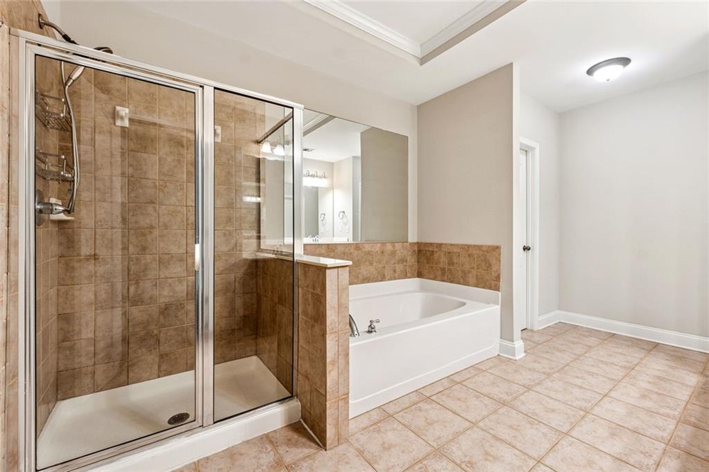 3184 Buck Way Alpharetta, GA 30004 - Photo 24 of 48 a bathroom with a bathtub and a shower