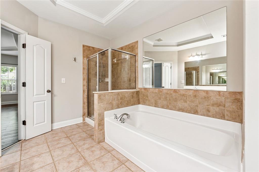 3184 Buck Way Alpharetta, GA 30004 - Photo 26 of 48 a spacious bathroom with a bathtub and a shower