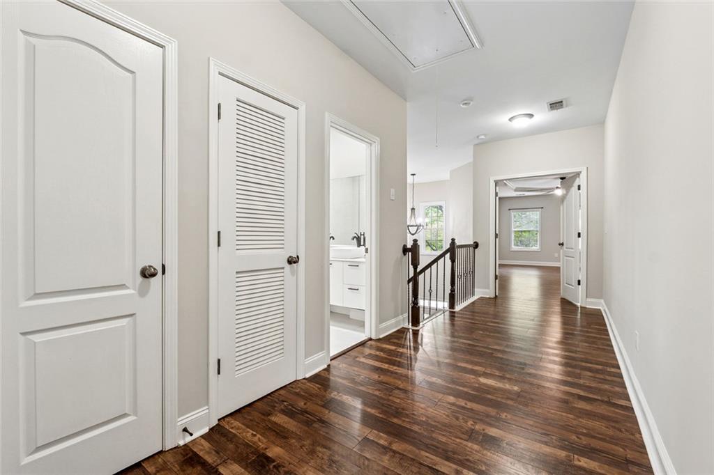 3184 Buck Way Alpharetta, GA 30004 - Photo 27 of 48 a view of a hallway with wooden floor and staircase