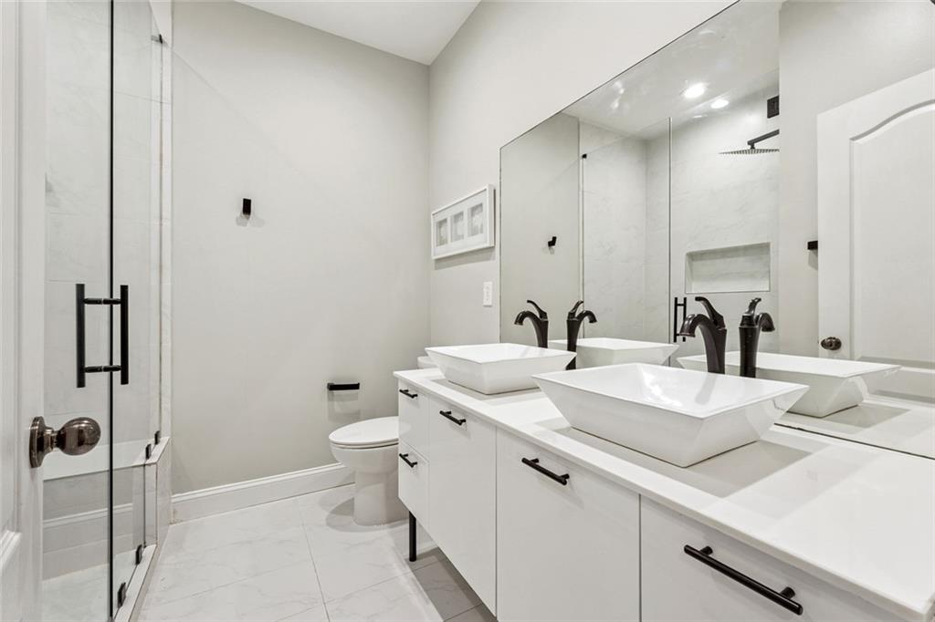 3184 Buck Way Alpharetta, GA 30004 - Photo 34 of 48 a bathroom with a double vanity sink mirror and toilet