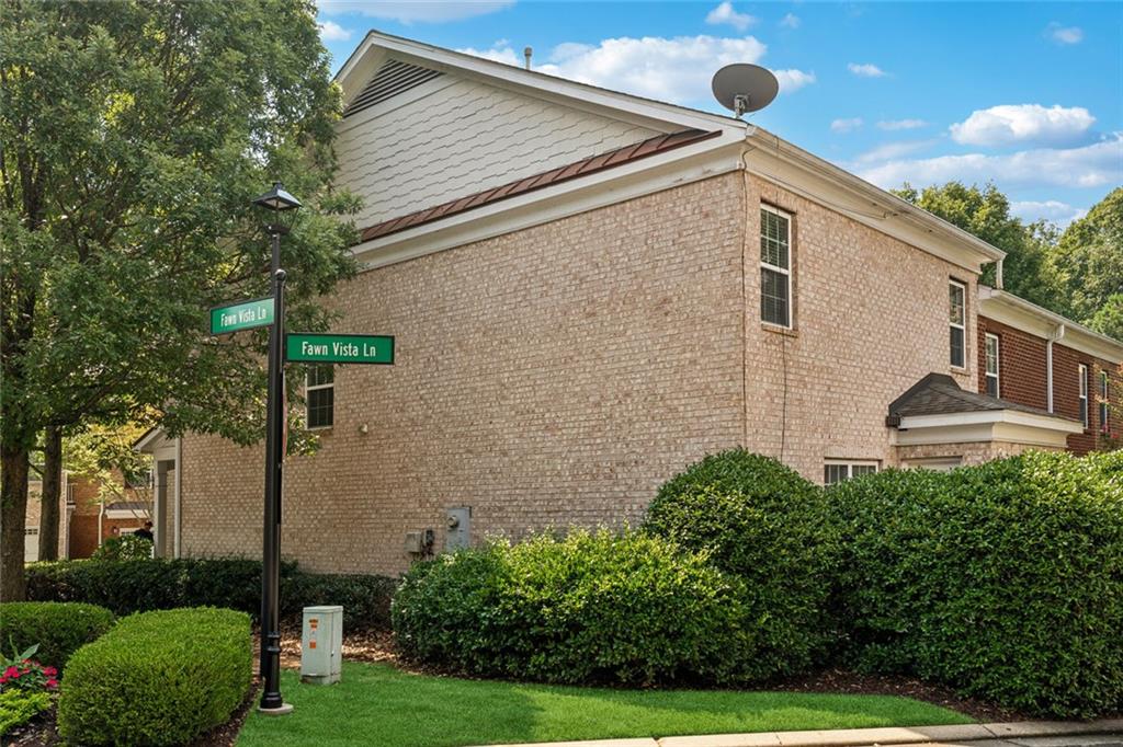 3184 Buck Way Alpharetta, GA 30004 - Photo 40 of 48 a front view of a house with a yard