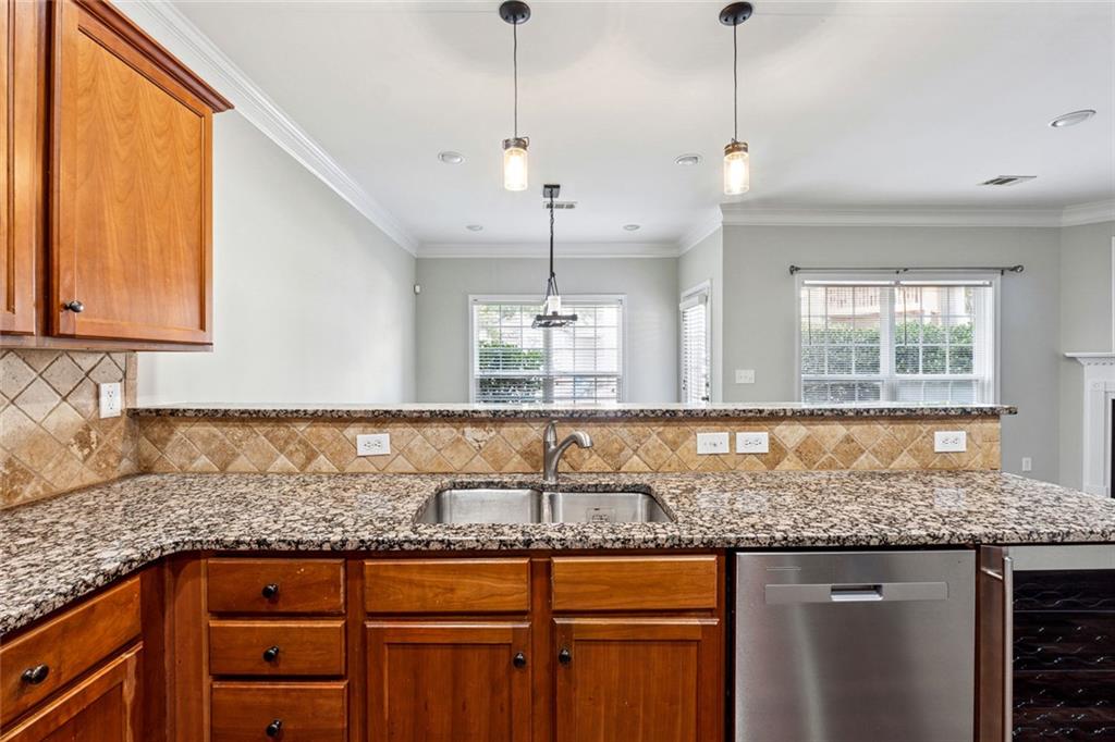 3184 Buck Way Alpharetta, GA 30004 - Photo 10 of 48 a kitchen with granite countertop a sink and a wooden floor