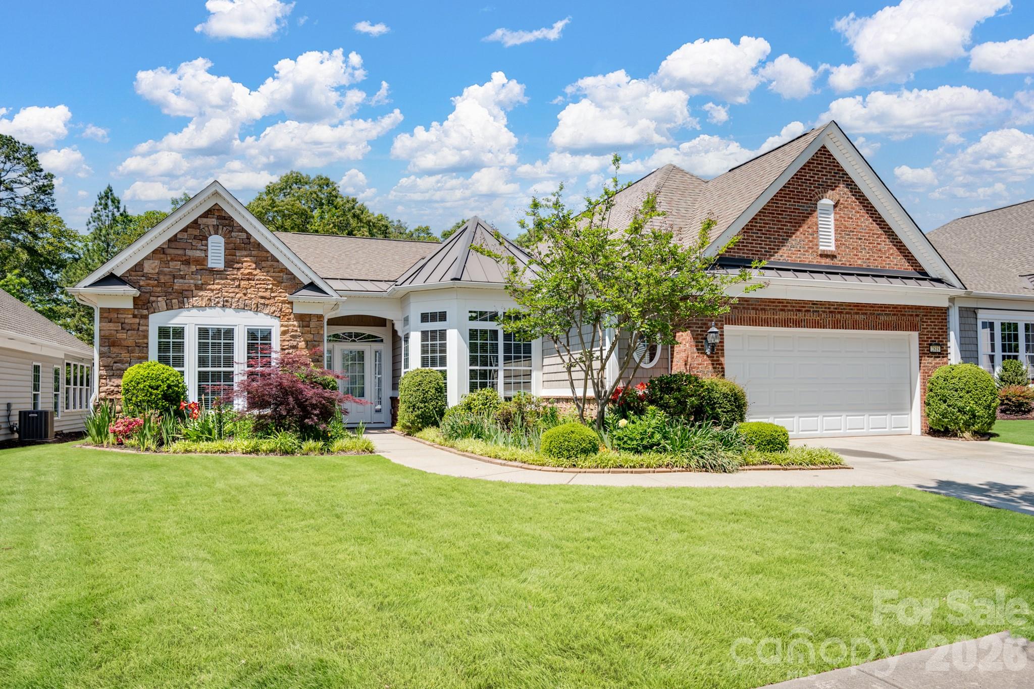2818 Mandarin Street Fort Mill, SC 29707 - Photo 1 of 48 a front view of a house with a yard