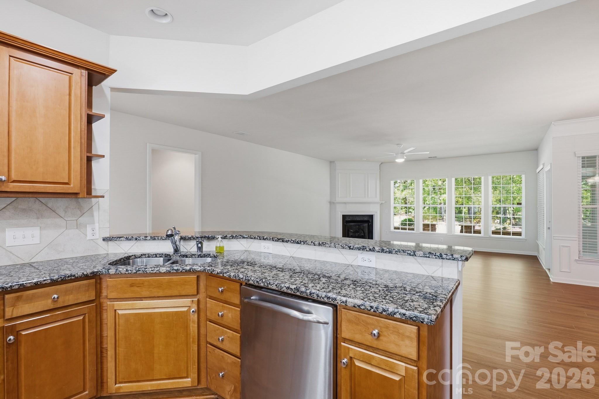 2818 Mandarin Street Fort Mill, SC 29707 - Photo 15 of 48 a kitchen with granite countertop a sink stove and cabinets
