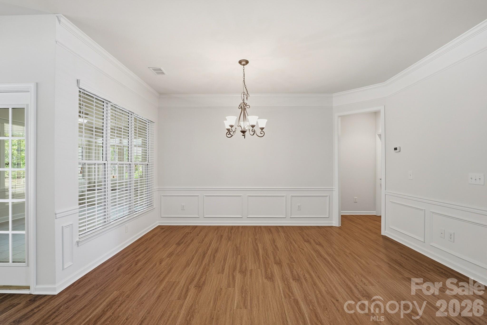2818 Mandarin Street Fort Mill, SC 29707 - Photo 16 of 48 wooden floor in an empty room with a window