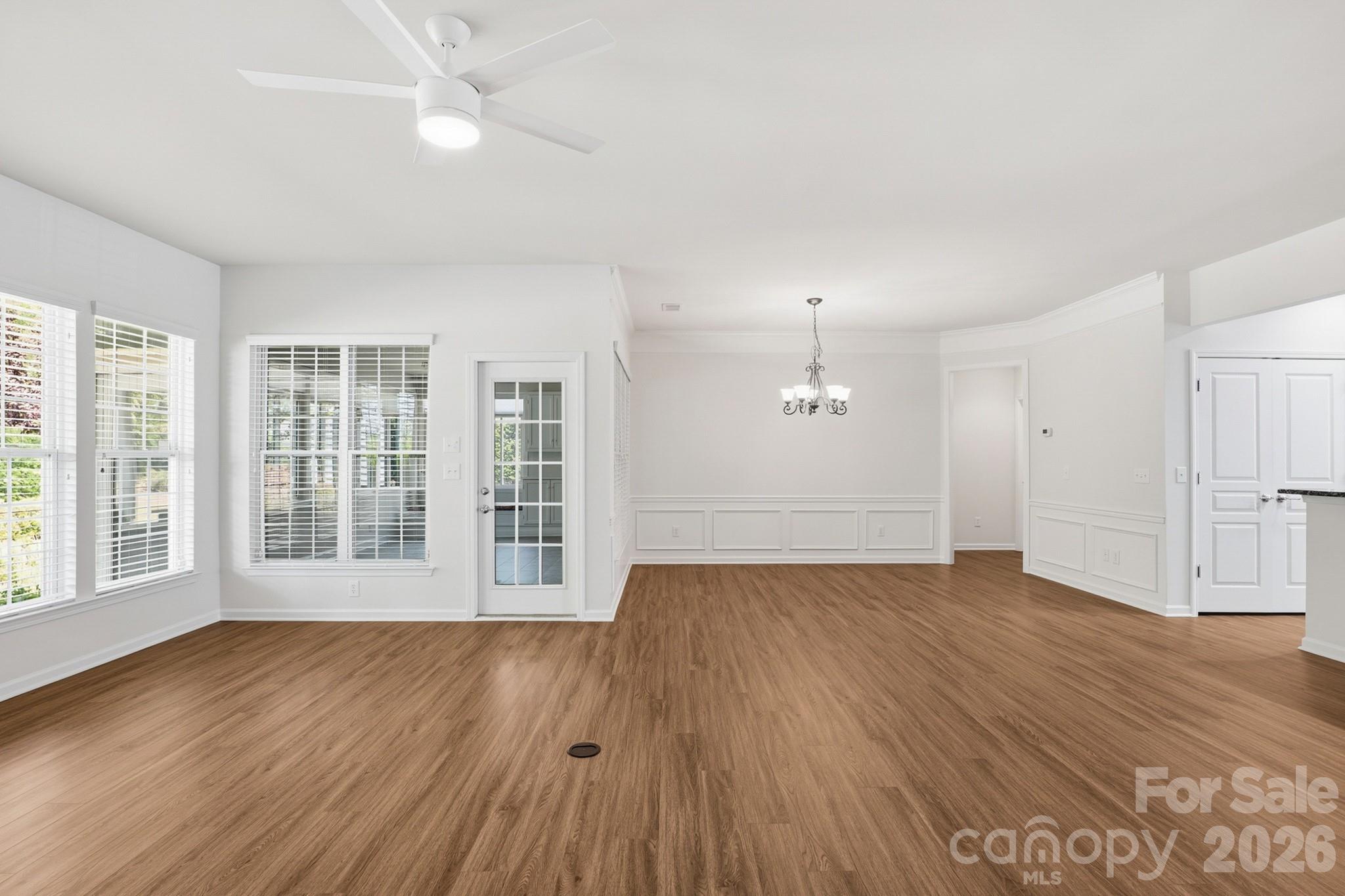 2818 Mandarin Street Fort Mill, SC 29707 - Photo 19 of 48 a view of an empty room with wooden floor and a window