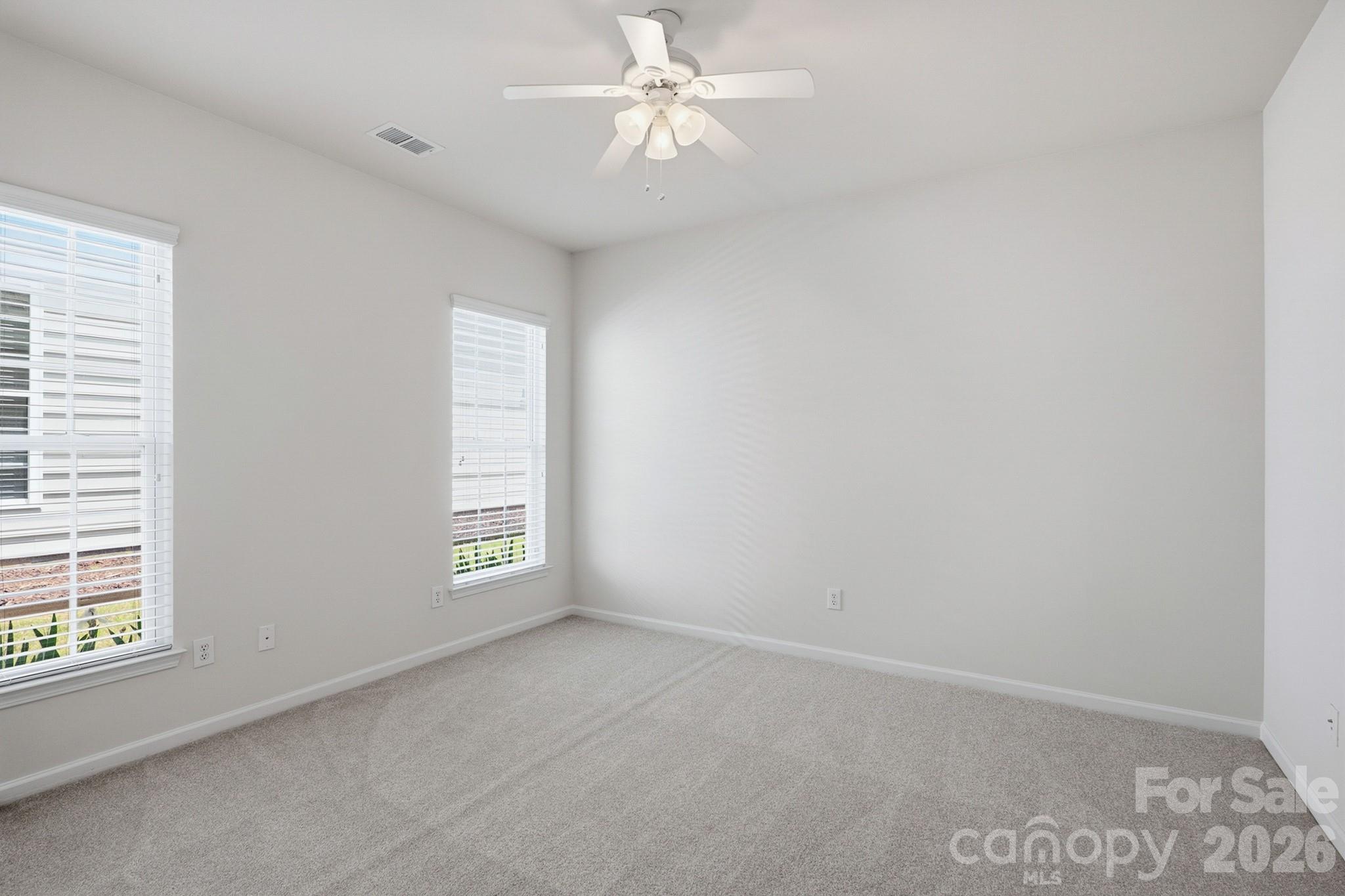 2818 Mandarin Street Fort Mill, SC 29707 - Photo 28 of 48 an empty room with windows and fan