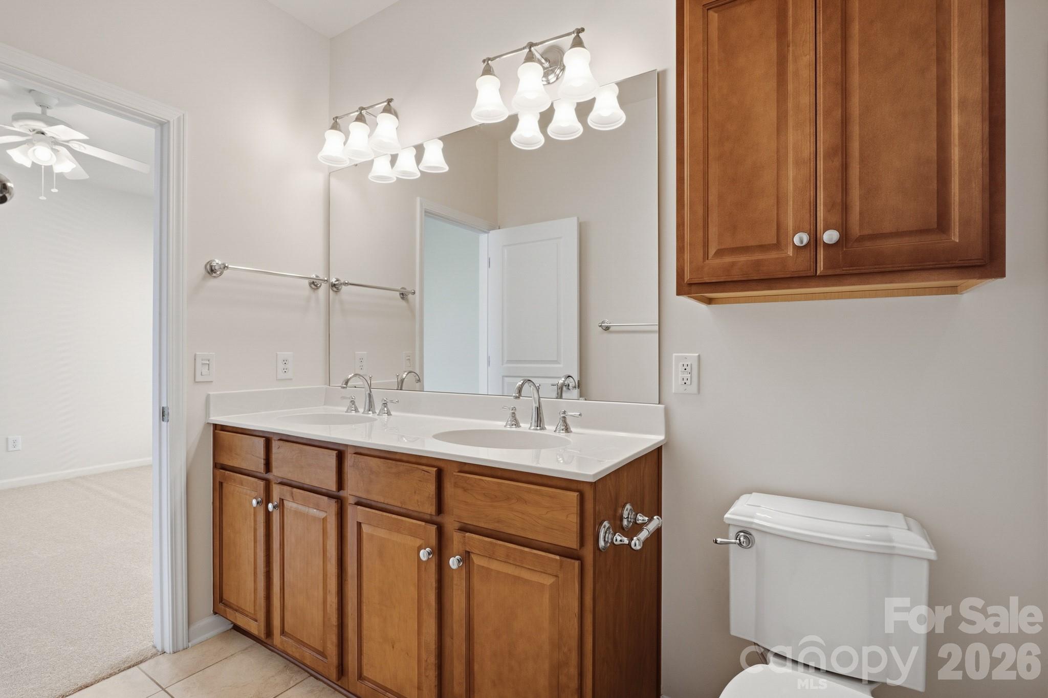 2818 Mandarin Street Fort Mill, SC 29707 - Photo 29 of 48 a bathroom with a sink a toilet and a mirror