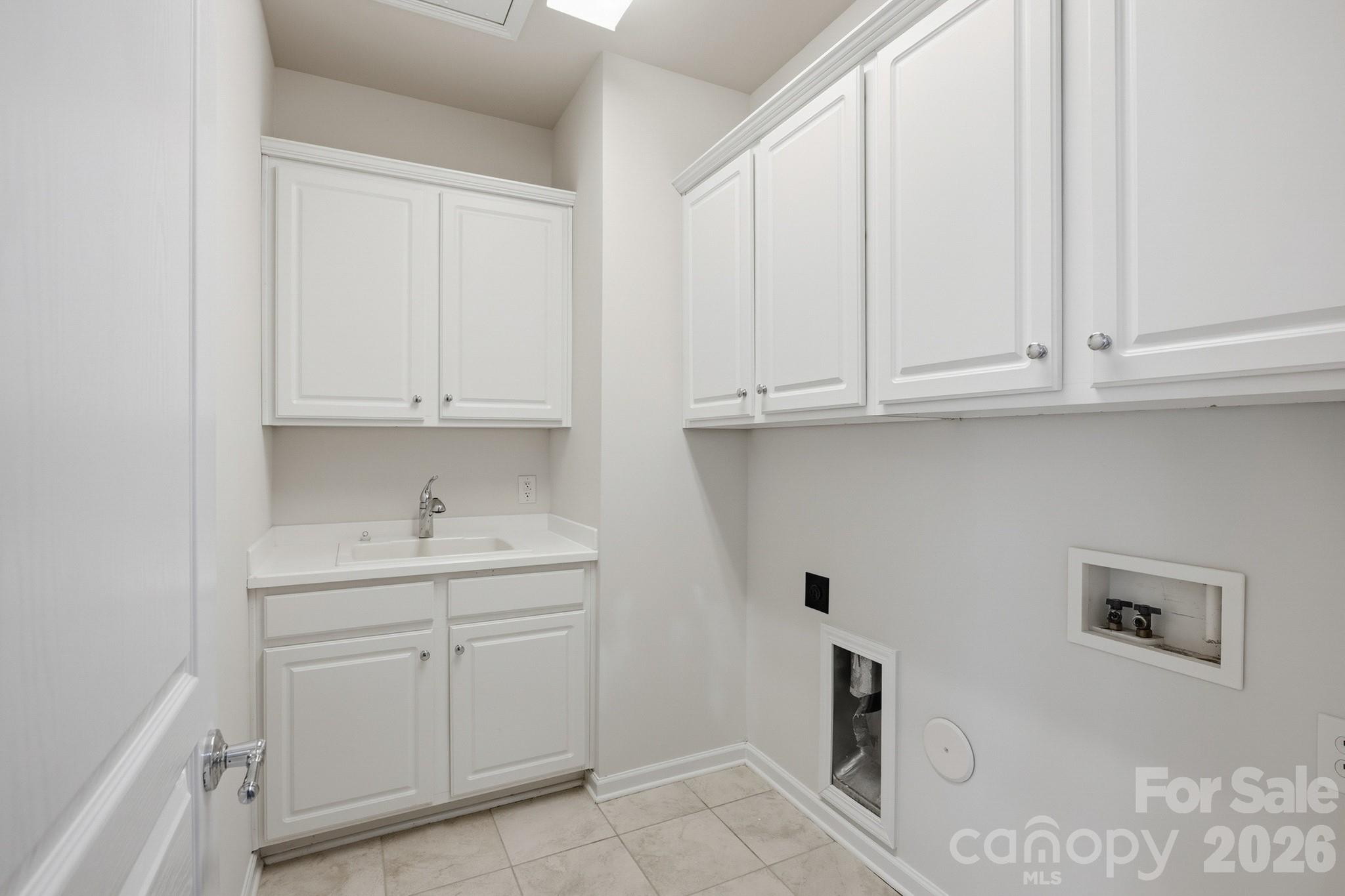 2818 Mandarin Street Fort Mill, SC 29707 - Photo 31 of 48 a kitchen with white cabinets and a sink
