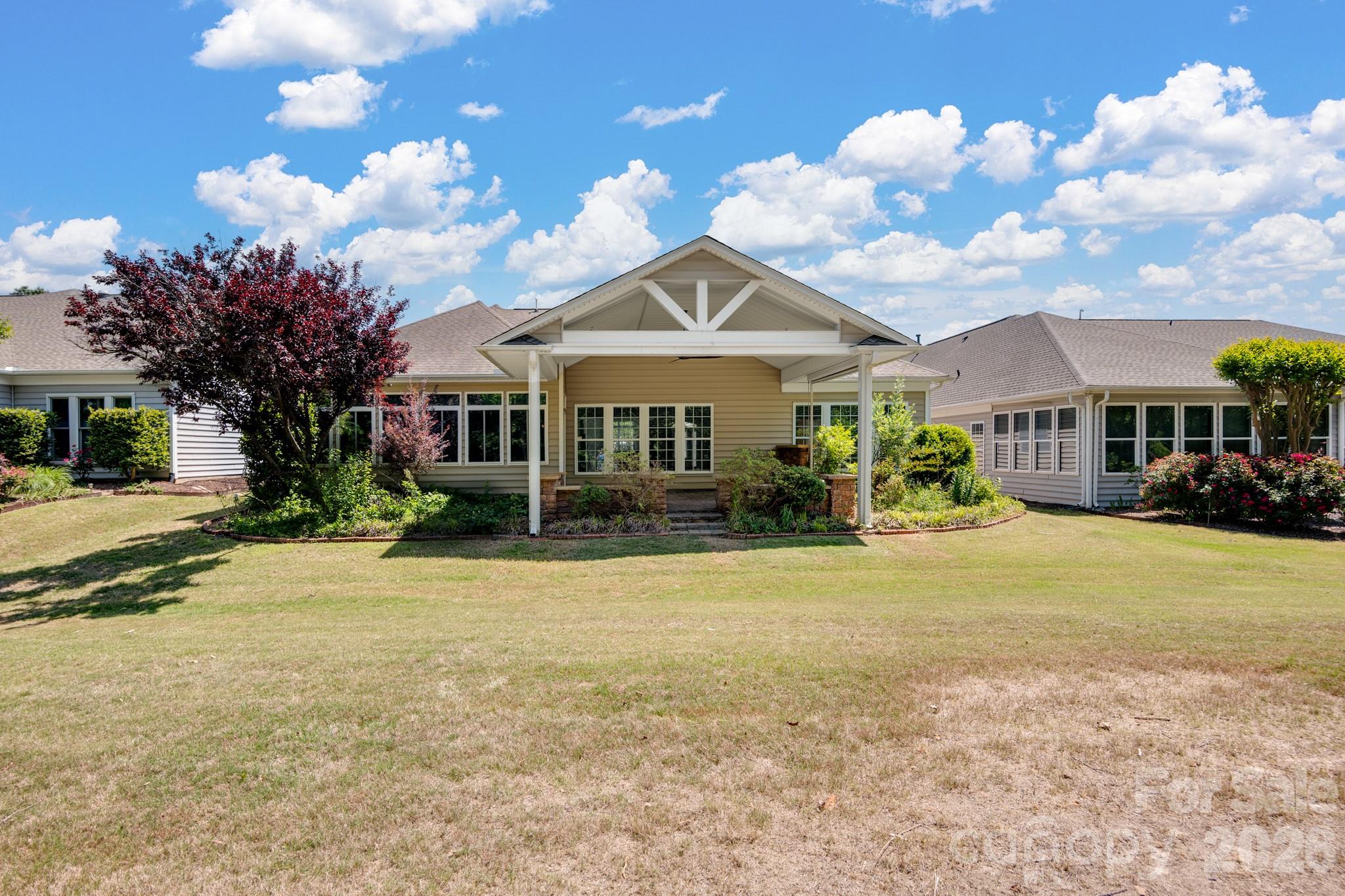 2818 Mandarin Street Fort Mill, SC 29707 - Photo 39 of 48 a front view of a house with a big yard and a large tree