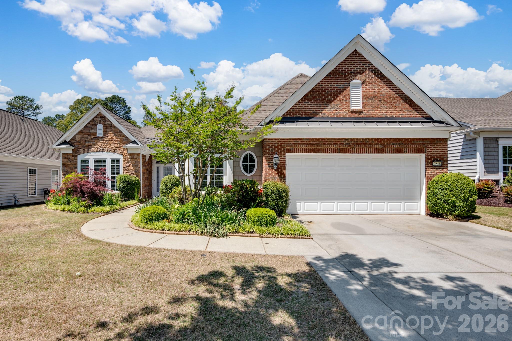 2818 Mandarin Street Fort Mill, SC 29707 - Photo 43 of 48 a front view of a house with a yard and garage