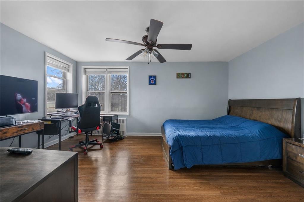 7520 Ridge Boulevard, Unit 2A Brooklyn, NY 11209 - Photo 11 of 15 a bedroom with furniture and a window