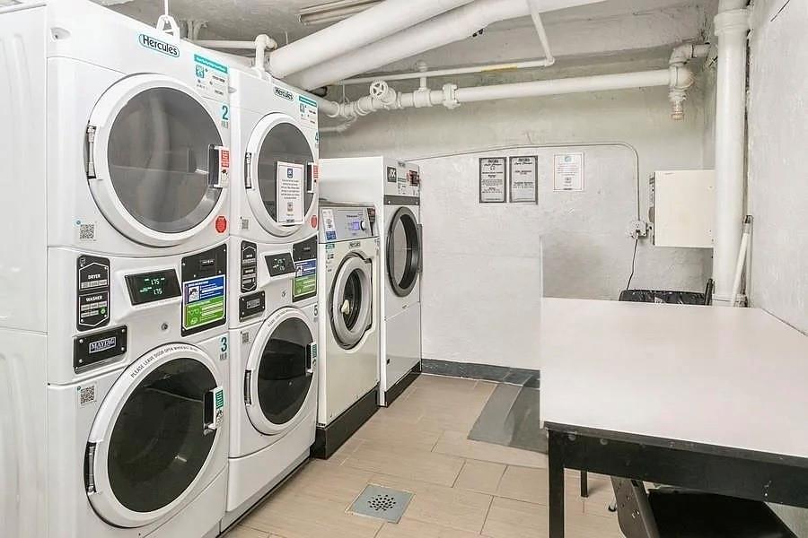 7520 Ridge Boulevard, Unit 2A Brooklyn, NY 11209 - Photo 14 of 15 a utility room with dryer and washer