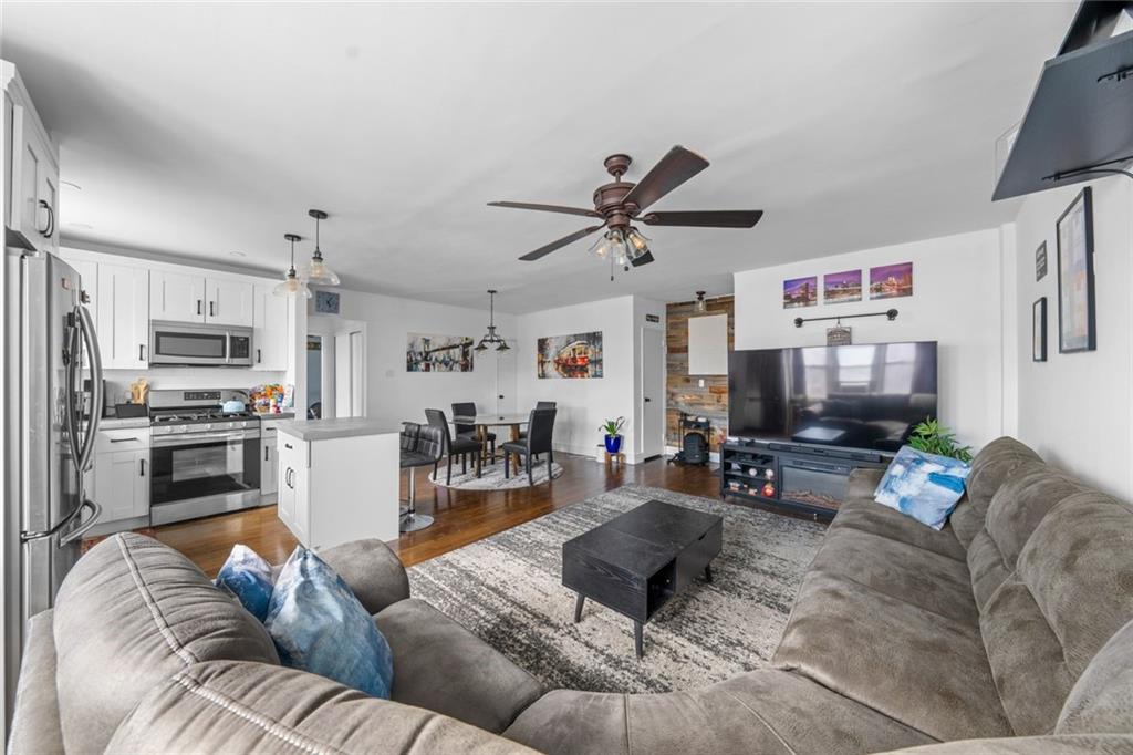 7520 Ridge Boulevard, Unit 2A Brooklyn, NY 11209 - Photo 2 of 15 a living room with furniture kitchen view and a refrigerator
