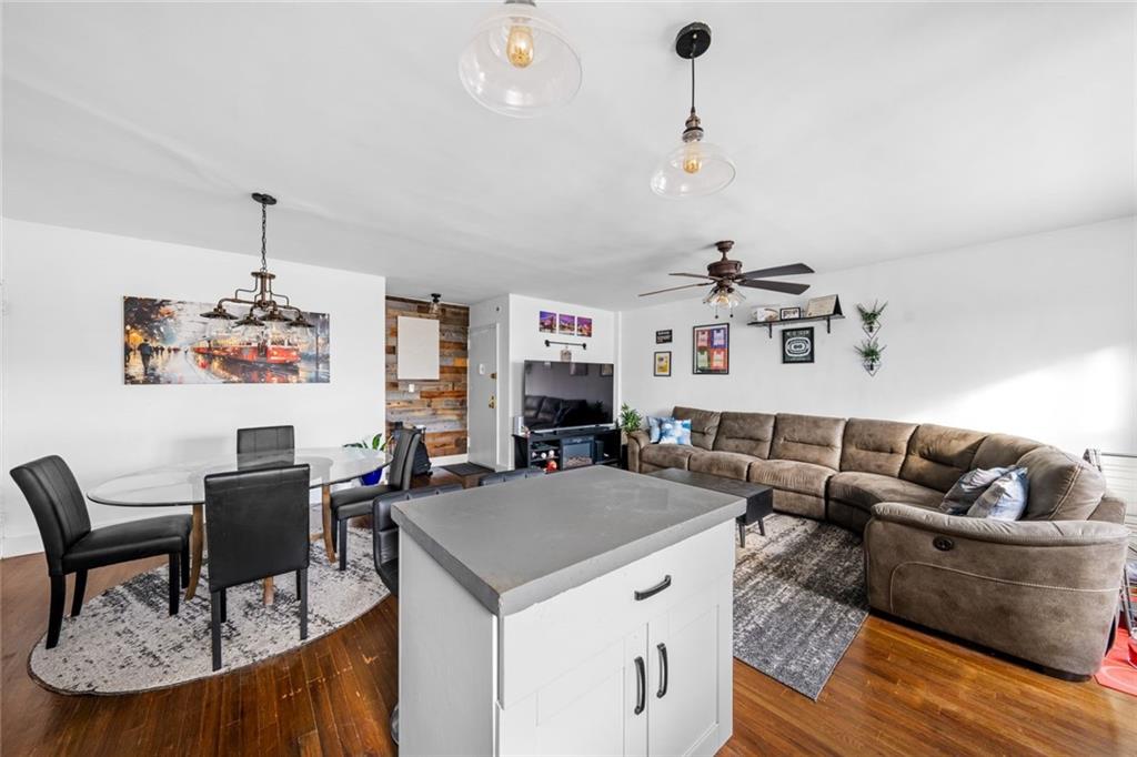 7520 Ridge Boulevard, Unit 2A Brooklyn, NY 11209 - Photo 7 of 15 a living room with furniture and kitchen view