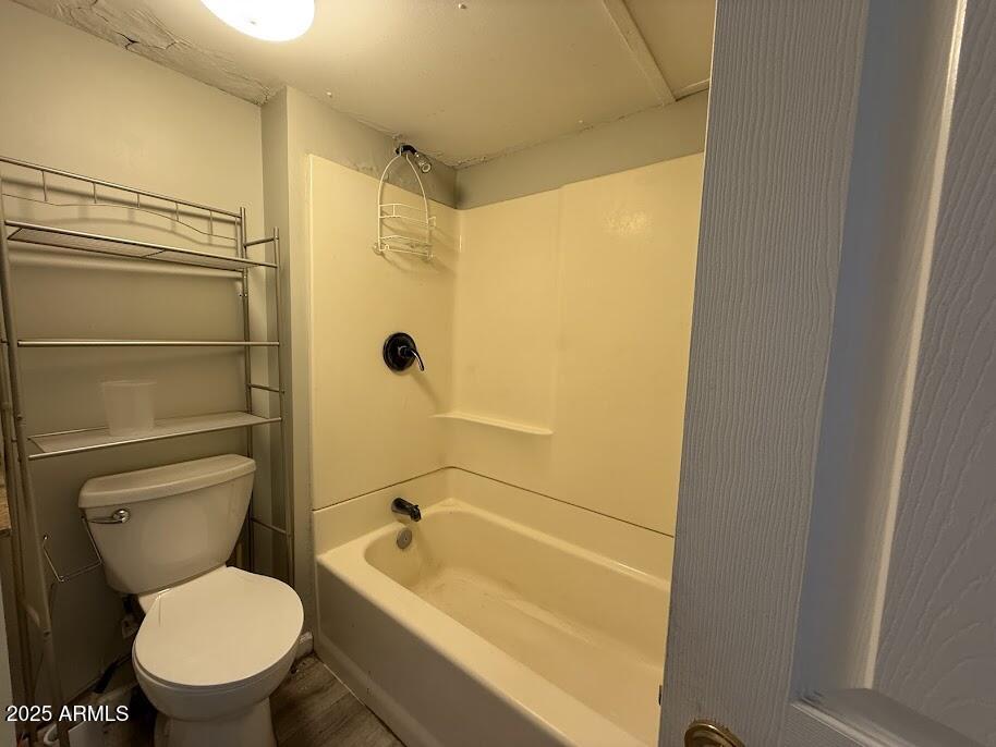 17601 North 22nd Place Phoenix, AZ 85022 - Photo 15 of 23 a white toilet sitting next to a bath tub