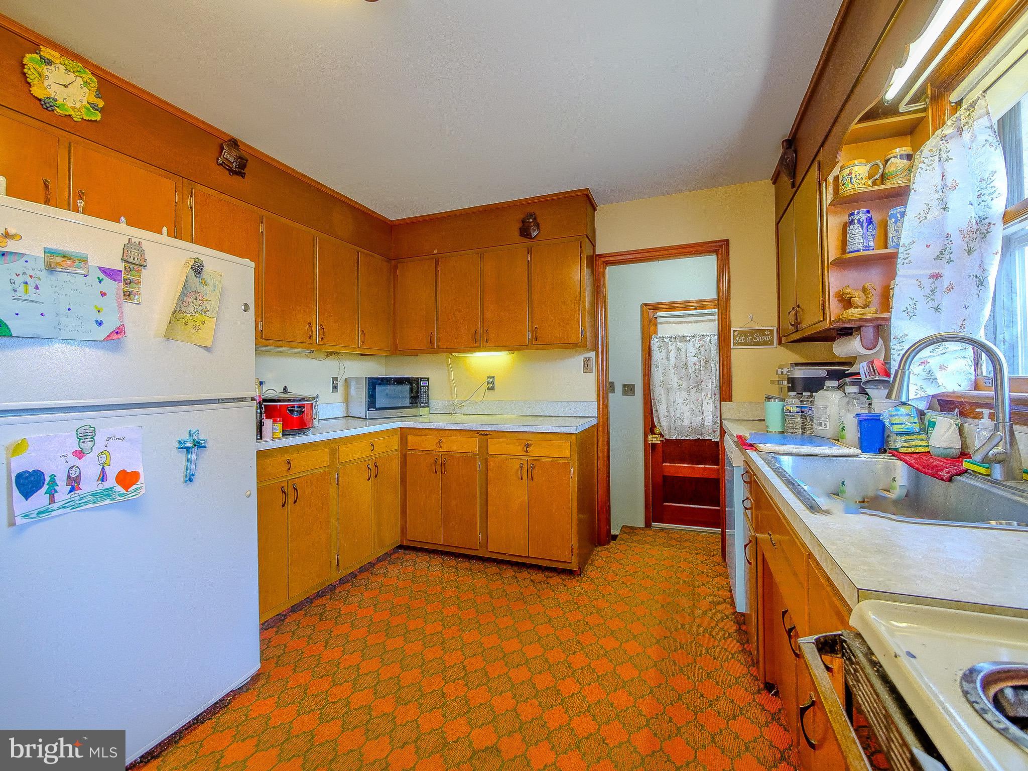 2601 Larkin Road Upper Chichester, PA 19061 - Photo 8 of 30 a kitchen that has a sink and a stove in it