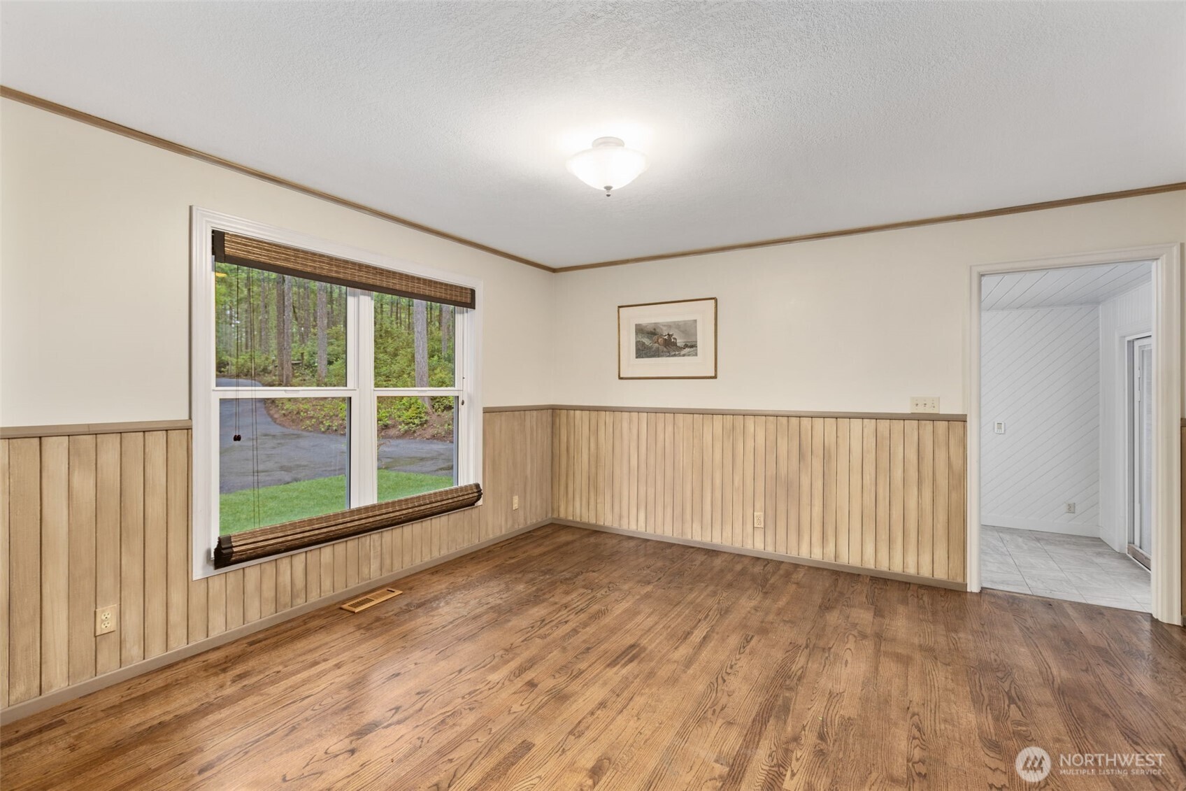 100 East Twanoh Heights Road South Belfair, WA 98528 - Photo 9 of 40 an empty room with wooden floor and windows