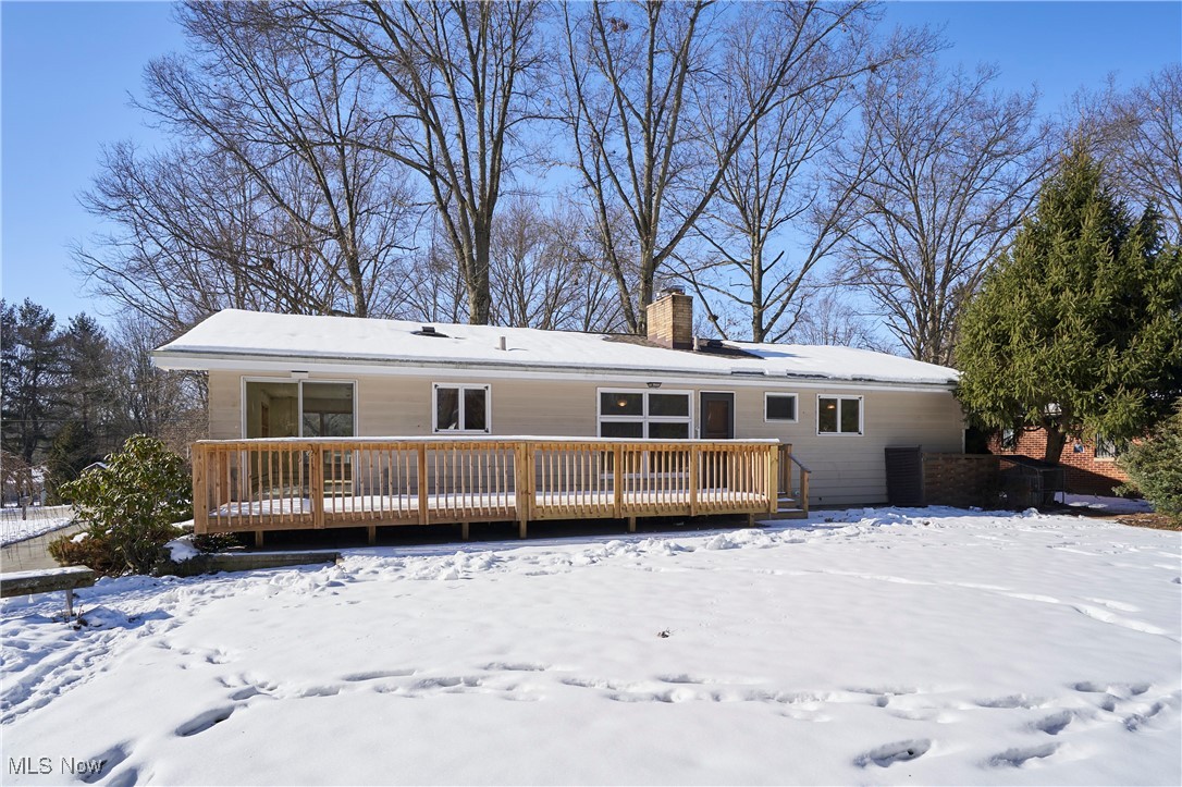 3005 Stanley Road Akron, OH 44333 - Photo 24 of 26 Snow covered rear of property with a wooden deck