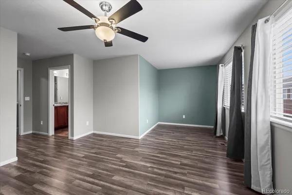 a bathroom with a granite countertop sink and a bathtub