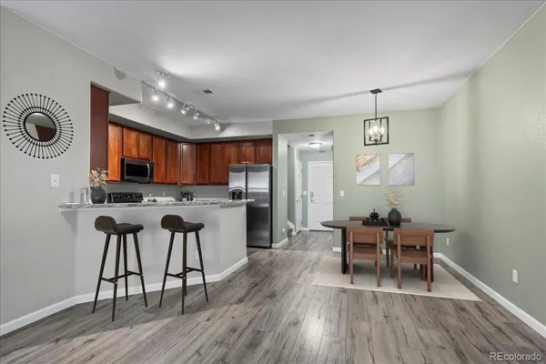 a view of kitchen with cabinets and wooden floor