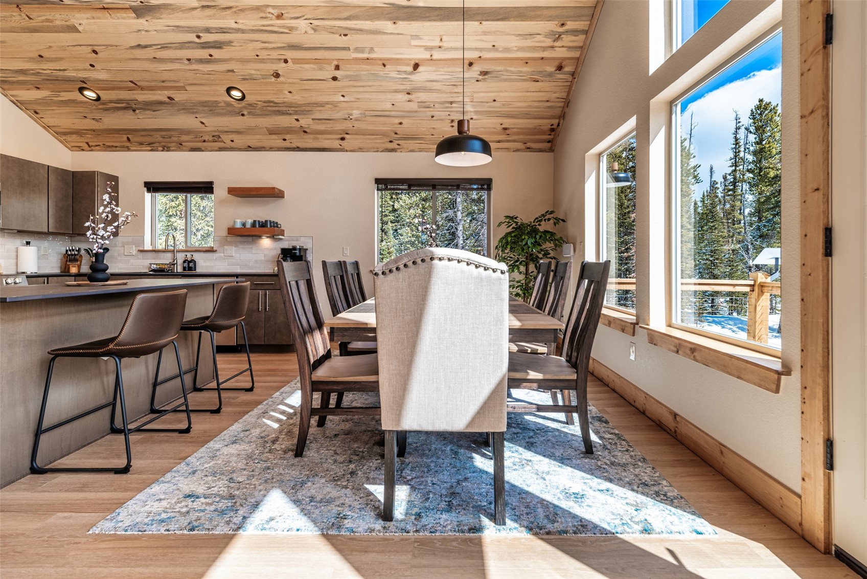 526 Porcupine Road Fairplay, CO 80440 - Photo 16 of 45 a dining room with wooden floor and glass windows